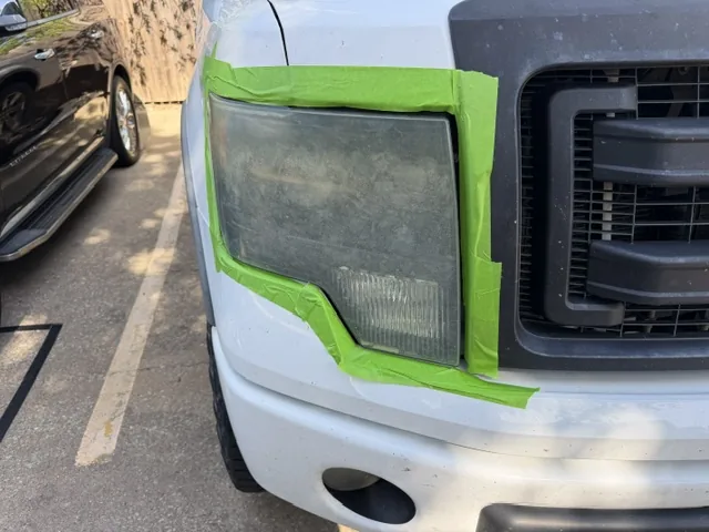 Cloudy oxidized Ford F-150 headlight before restoration
